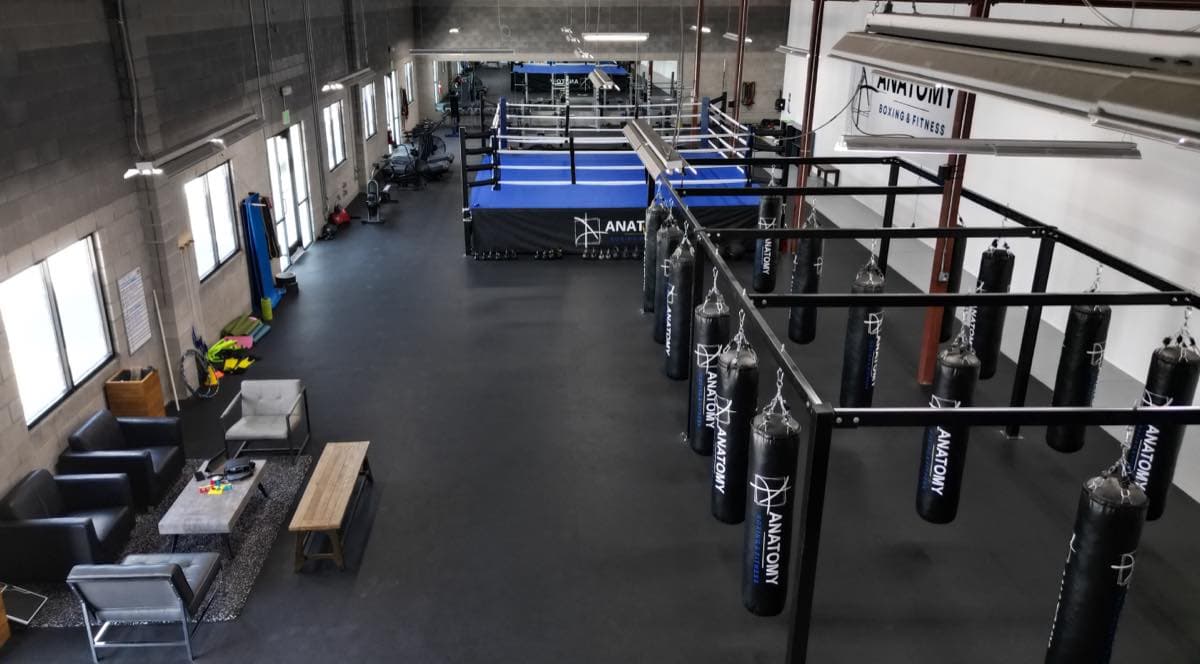The ring and heavy bags inside Anatomy Boxing and Fitness